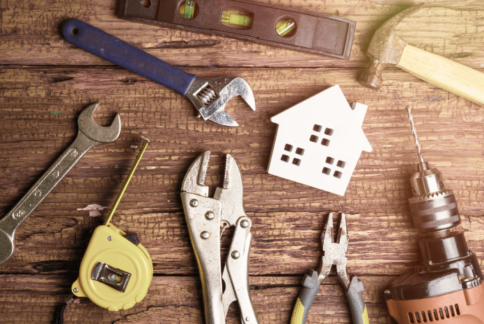 Tools on Wooden Background